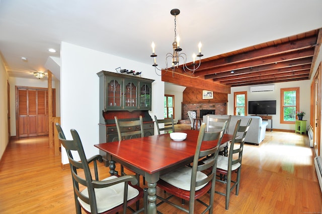 11 Brianwood Ln, Granby, CT 06035 - dining space featuring healthy amount of natural light, light wood-type flooring, a chandelier, beamed ceiling, and an AC wall unit