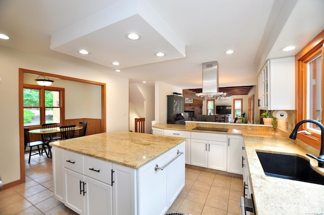 11 Brianwood Ln, Granby, CT 06035 - kitchen featuring light tile patterned flooring, a kitchen island, light stone counters, recessed lighting, and white cabinets