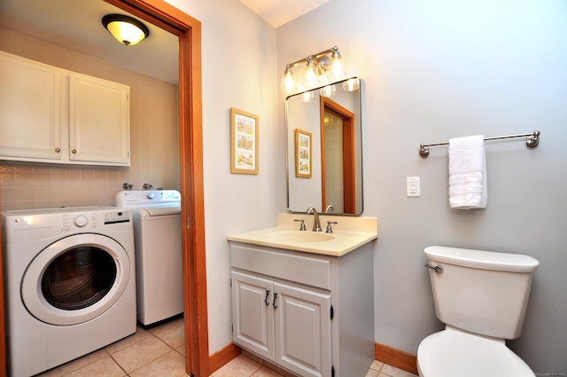 11 Brianwood Ln, Granby, CT 06035 - laundry area with washer and clothes dryer and light tile patterned floors