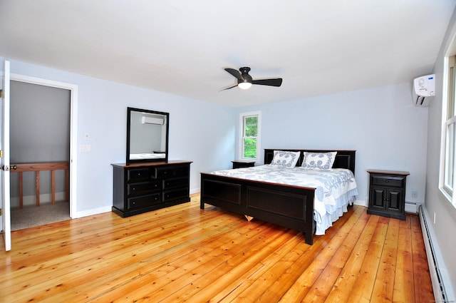 11 Brianwood Ln, Granby, CT 06035 - bedroom featuring baseboard heating, a wall unit AC, light wood finished floors, and a ceiling fan