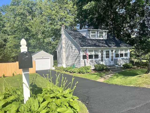 10 George St, Trumbull, CT 06611 - bungalow-style house featuring driveway, an outdoor structure, a garage, and a chimney