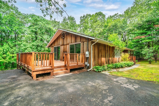 1037 Bartholomew Rd, Middletown, CT 06457 - chalet / cabin with board and batten siding and a wooden deck