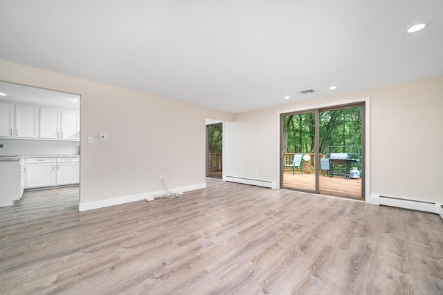 1037 Bartholomew Rd, Middletown, CT 06457 - unfurnished living room featuring baseboard heating, light wood-type flooring, a baseboard radiator, and recessed lighting