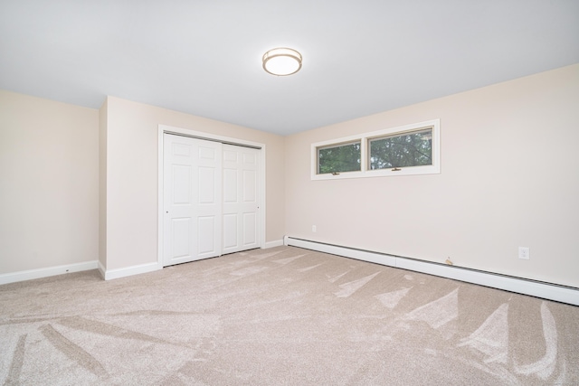 1037 Bartholomew Rd, Middletown, CT 06457 - unfurnished bedroom with baseboard heating, carpet floors, and a closet
