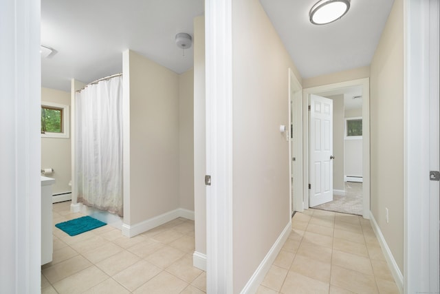 1037 Bartholomew Rd, Middletown, CT 06457 - corridor with a baseboard radiator, light tile patterned floors, and baseboard heating