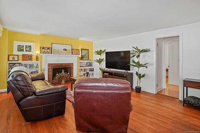 57 Lakeview Ave, Hamden, CT 06514 - living room featuring wood finished floors and a fireplace