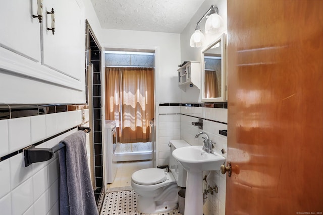 57 Lakeview Ave, Hamden, CT 06514 - half bath with tile walls, wainscoting, and a textured ceiling