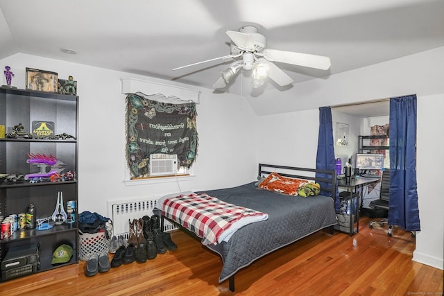 57 Lakeview Ave, Hamden, CT 06514 - bedroom with vaulted ceiling, wood finished floors, radiator, and a ceiling fan