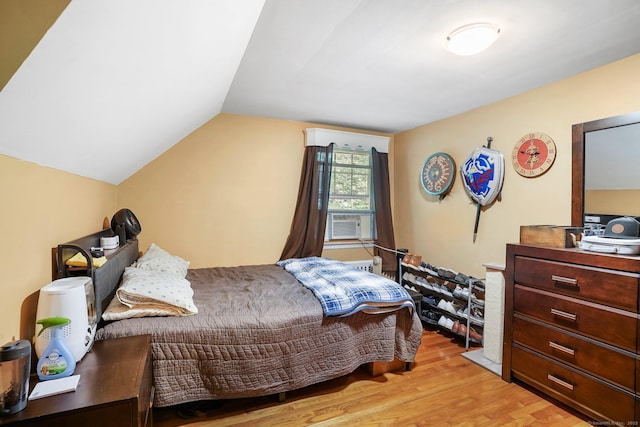 57 Lakeview Ave, Hamden, CT 06514 - bedroom with light wood-type flooring, lofted ceiling, and cooling unit