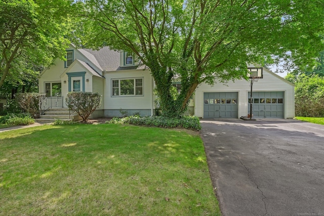 57 Lakeview Ave, Hamden, CT 06514 - view of front facade featuring asphalt driveway, a front yard, a garage, and roof with shingles