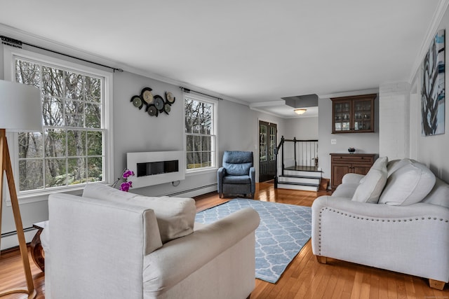 60 Ledgeview Ln, Guilford, CT 06437 - living area featuring ornamental molding, wood finished floors, stairs, and baseboard heating