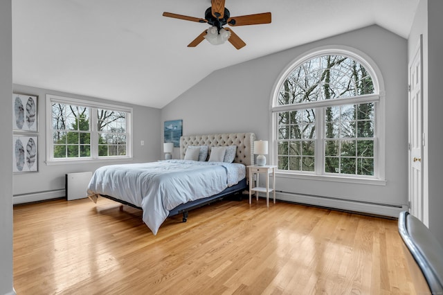 60 Ledgeview Ln, Guilford, CT 06437 - bedroom with a baseboard heating unit, baseboard heating, lofted ceiling, multiple windows, and wood finished floors