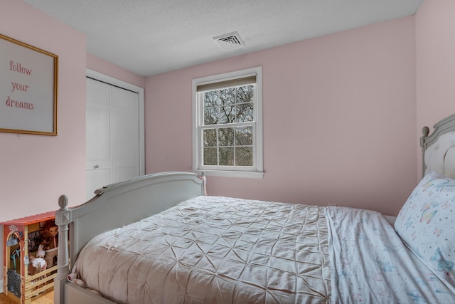 60 Ledgeview Ln, Guilford, CT 06437 - bedroom with a textured ceiling and a closet