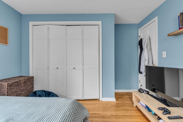 60 Ledgeview Ln, Guilford, CT 06437 - bedroom with light wood-style flooring and a closet