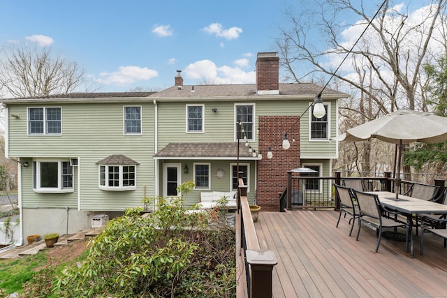 60 Ledgeview Ln, Guilford, CT 06437 - back of house with outdoor dining space, a chimney, and a deck