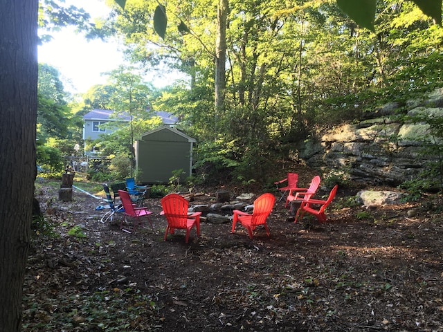 60 Ledgeview Ln, Guilford, CT 06437 - view of yard with a fire pit and a storage unit