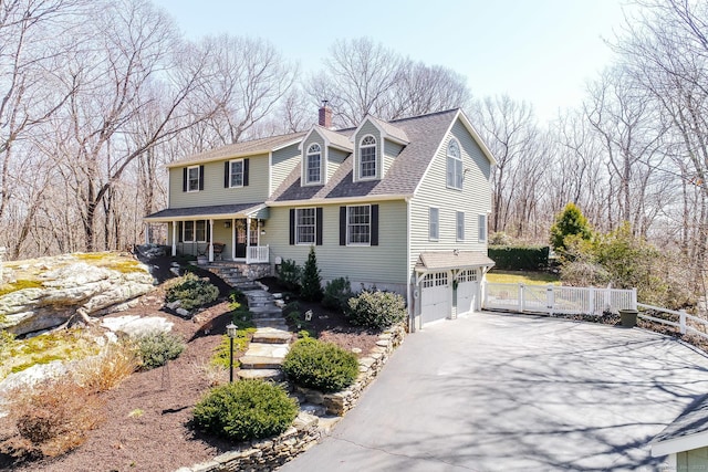 60 Ledgeview Ln, Guilford, CT 06437 - view of front of home featuring an attached garage, covered porch, a chimney, driveway, and a gate
