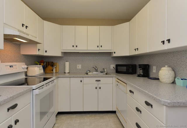 948 Heritage Vlg Unit A, Southbury, CT 06488 - kitchen with white appliances, under cabinet range hood, light countertops, and backsplash