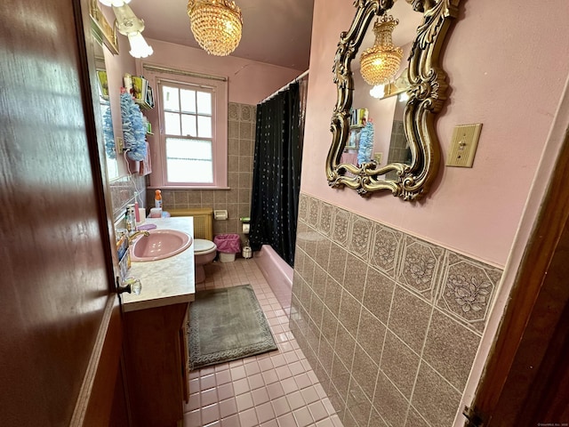 734 Howe Ave, Shelton, CT 06484 - bathroom featuring tile patterned flooring, tile walls, vanity, a wainscoted wall, and shower / bath combination with curtain