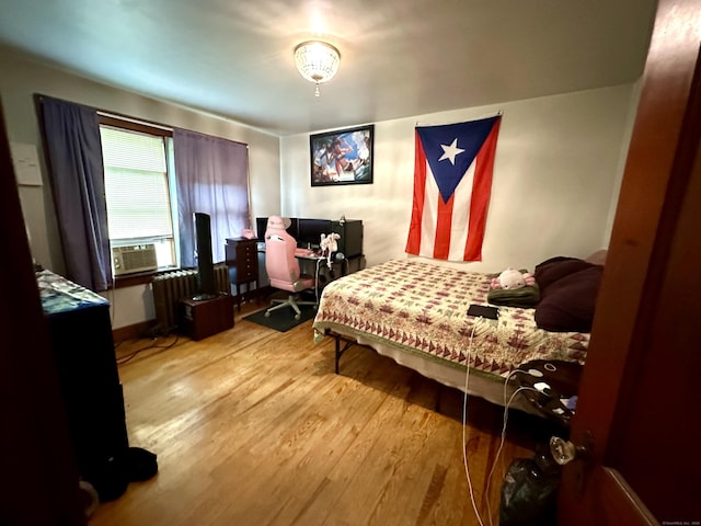 734 Howe Ave, Shelton, CT 06484 - bedroom featuring wood finished floors, radiator heating unit, and cooling unit