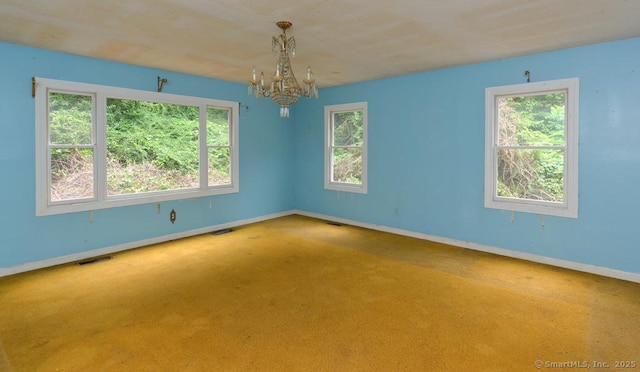 479 Kettletown Rd, Southbury, CT 06488 - unfurnished room featuring a chandelier, plenty of natural light, and carpet floors