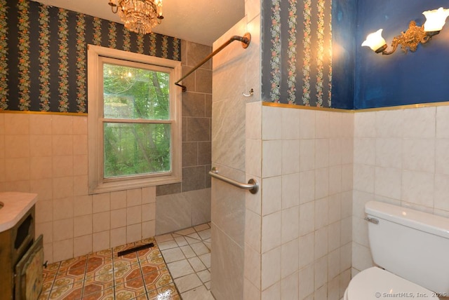 479 Kettletown Rd, Southbury, CT 06488 - full bathroom with tile walls, tiled shower, vanity, tile patterned flooring, and a wainscoted wall