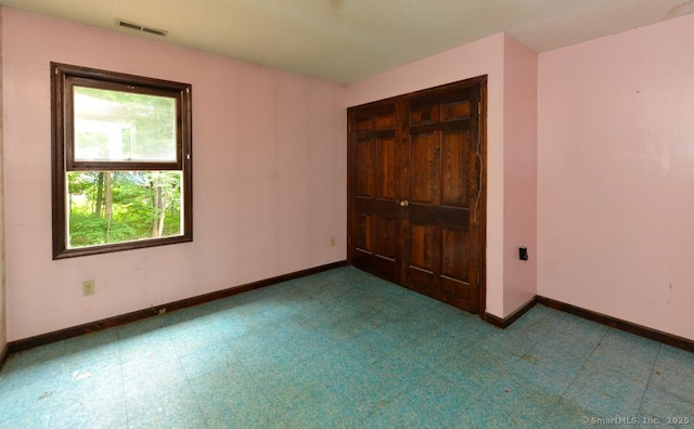 479 Kettletown Rd, Southbury, CT 06488 - unfurnished bedroom with a closet and tile patterned floors
