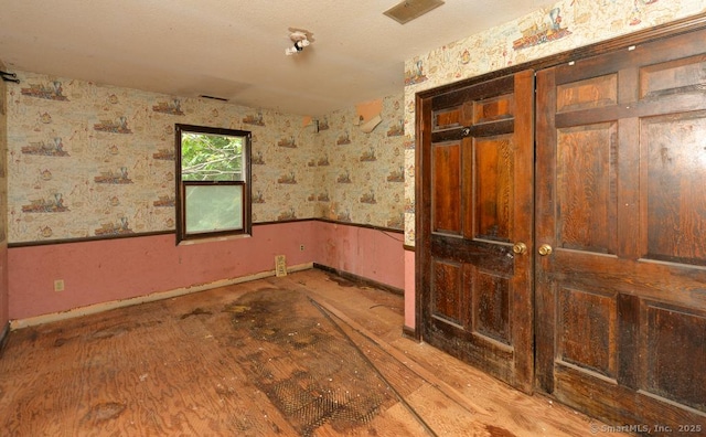 479 Kettletown Rd, Southbury, CT 06488 - spare room with baseboards and wallpapered walls