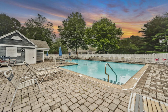 205 Windgate Cir Unit A, Monroe, CT 06468 - pool at dusk with a patio and a community pool