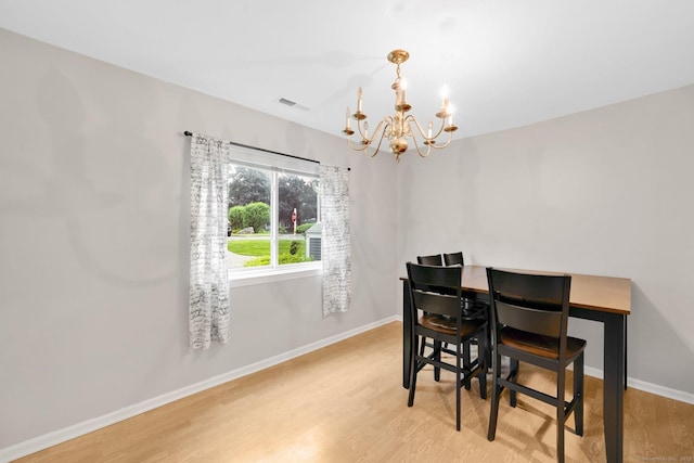 205 Windgate Cir Unit A, Monroe, CT 06468 - dining area with a chandelier and light wood-type flooring