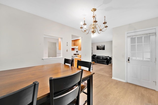 205 Windgate Cir Unit A, Monroe, CT 06468 - dining room with a chandelier and light wood-type flooring