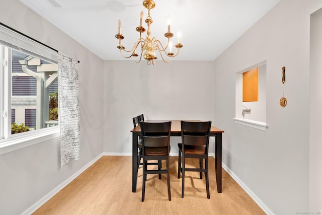 205 Windgate Cir Unit A, Monroe, CT 06468 - dining area featuring a chandelier and wood finished floors