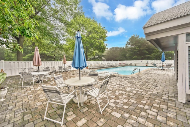 205 Windgate Cir Unit A, Monroe, CT 06468 - view of pool featuring outdoor dining area, a fenced backyard, a patio area, and view of wooded area