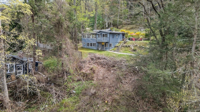 25 Brookbridge Dr, Newtown, CT 06482 - view of yard with a wooden deck, stairs, and a view of trees