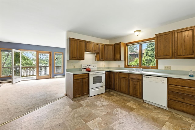 40 Alma Ave, Wolcott, CT 06716 - kitchen with white appliances, light stone finish flooring, light countertops, brown cabinetry, and a baseboard heating unit
