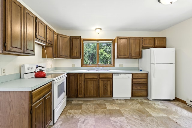 40 Alma Ave, Wolcott, CT 06716 - kitchen with white appliances, light countertops, stone finish floors, and brown cabinets