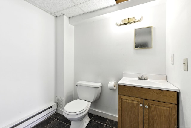 40 Alma Ave, Wolcott, CT 06716 - half bathroom featuring a baseboard heating unit, tile patterned flooring, vanity, and a drop ceiling
