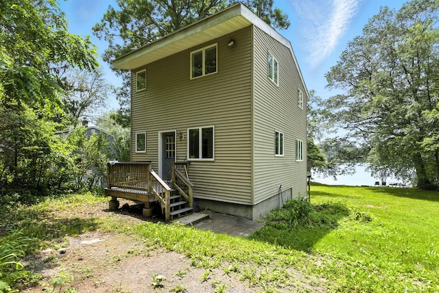 40 Alma Ave, Wolcott, CT 06716 - back of property featuring a deck and a lawn
