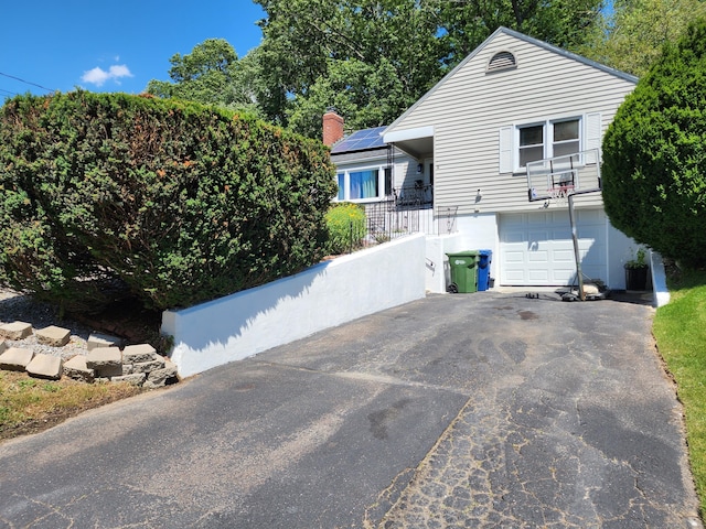 1014 N Worthy St, Windsor, CT 06095 - view of front of house featuring asphalt driveway and an attached garage