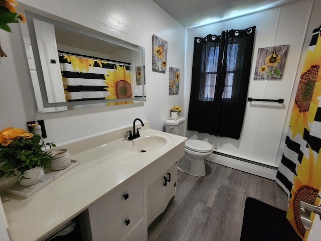 1014 N Worthy St, Windsor, CT 06095 - bathroom with a baseboard radiator, wood finished floors, vanity, and curtained shower