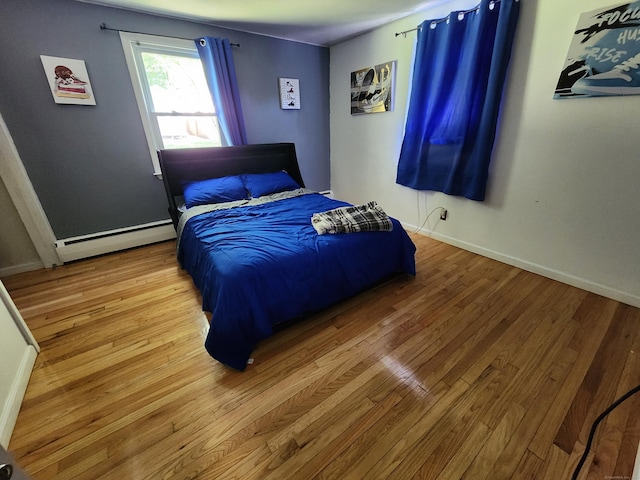 1014 N Worthy St, Windsor, CT 06095 - bedroom featuring a baseboard radiator and wood finished floors