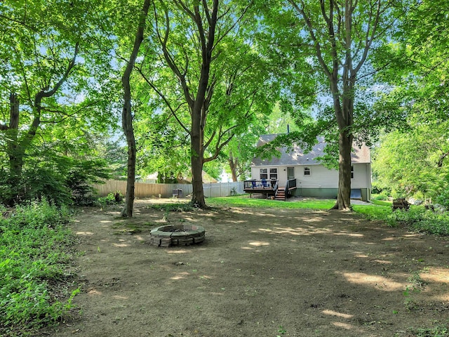 130 Irving St, Groton, CT 06355 - view of yard with a fire pit and a wooden deck