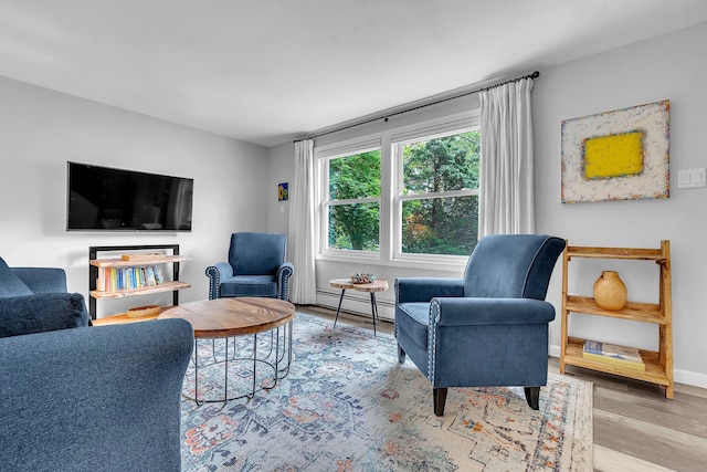 130 Irving St, Groton, CT 06355 - living area featuring baseboard heating and wood finished floors