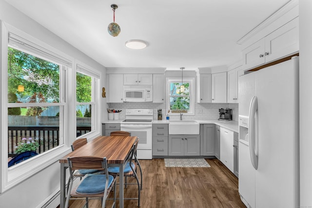 130 Irving St, Groton, CT 06355 - kitchen with white appliances, plenty of natural light, tasteful backsplash, and gray cabinets