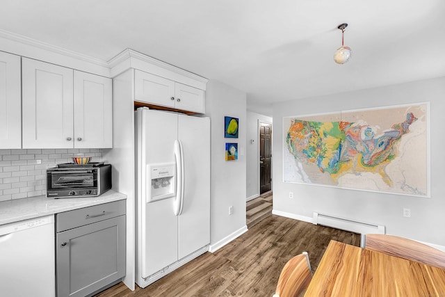 130 Irving St, Groton, CT 06355 - kitchen with white appliances, a baseboard heating unit, light countertops, tasteful backsplash, and wood finished floors