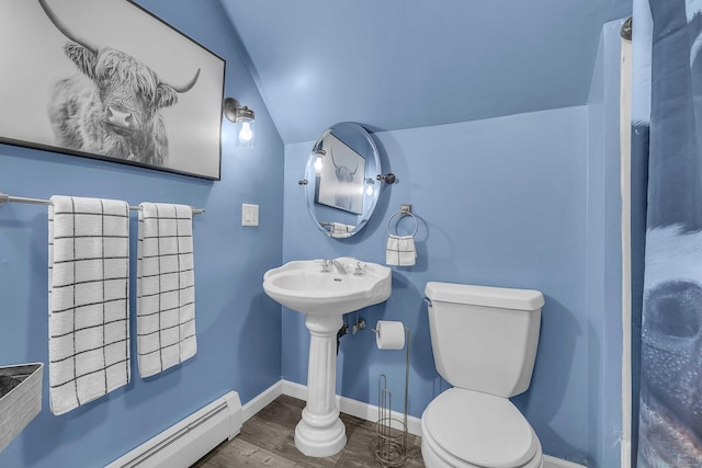130 Irving St, Groton, CT 06355 - bathroom featuring a baseboard heating unit, lofted ceiling, and wood finished floors