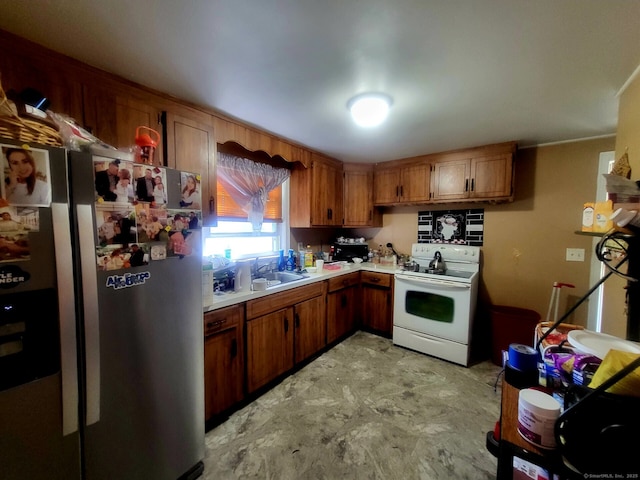 193 Mountain St, Hartford, CT 06106 - kitchen featuring freestanding refrigerator, electric stove, light countertops, and brown cabinets