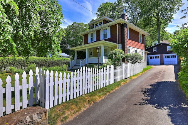 21 Oakwood Ave, Waterbury, CT 06708 - american foursquare style home with a porch, a garage, a chimney, and a fenced front yard