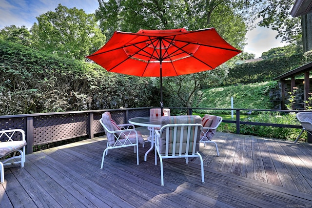 21 Oakwood Ave, Waterbury, CT 06708 - wooden deck with outdoor dining area and view of scattered trees