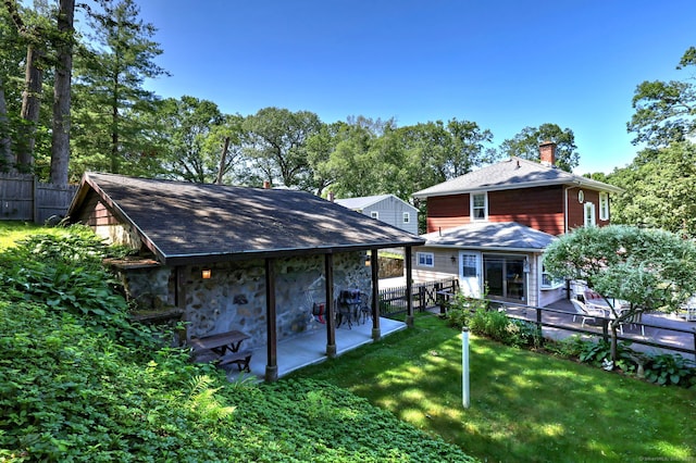 21 Oakwood Ave, Waterbury, CT 06708 - back of house featuring a chimney and stone siding